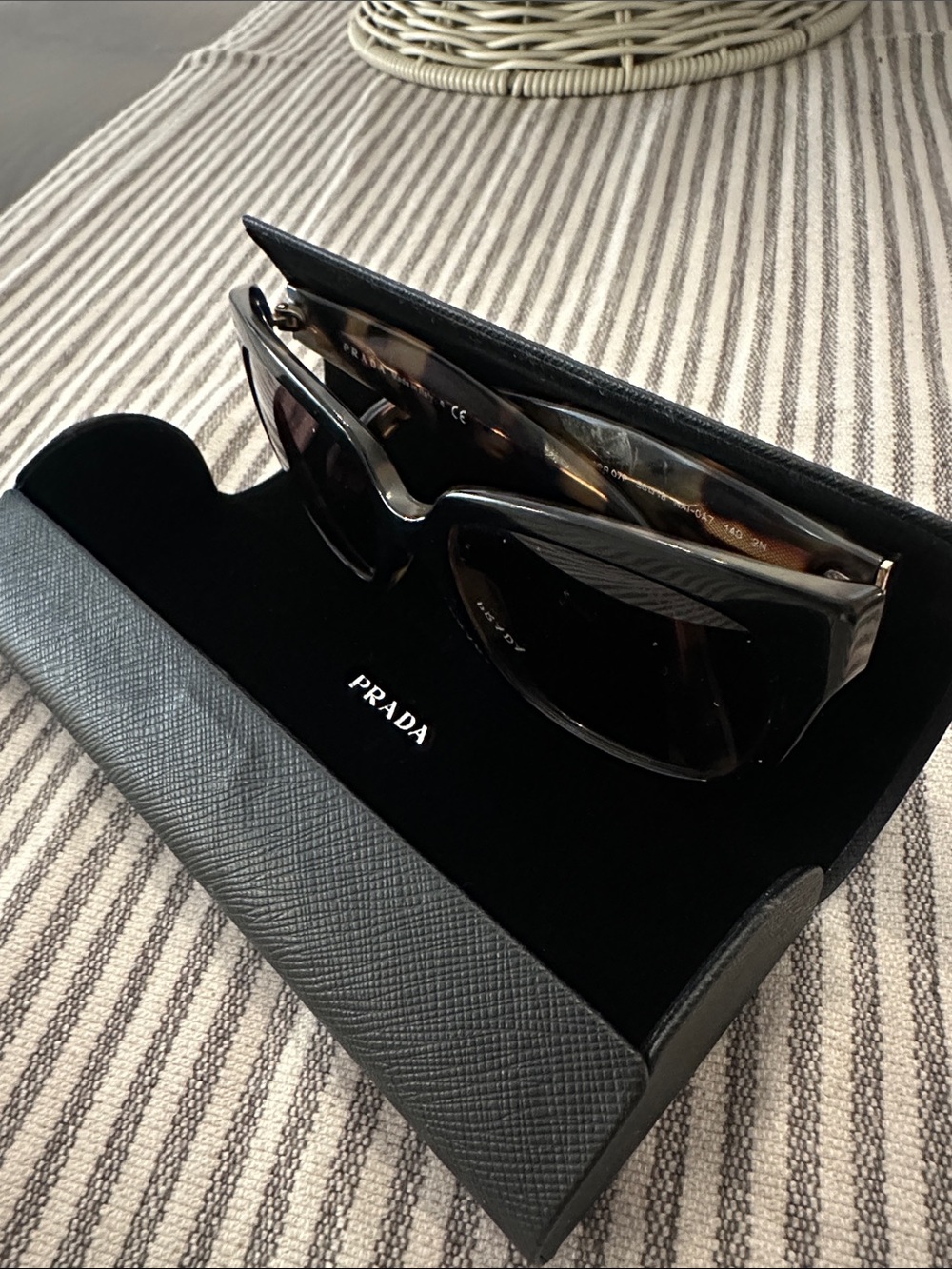 Prada Black Cat-Eye Sunglasses with Dark Lenses